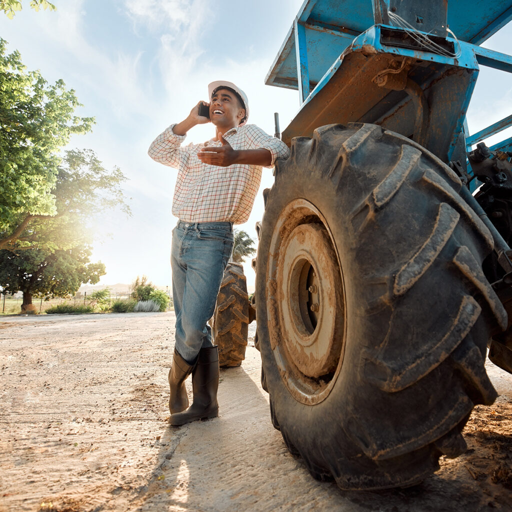 What is a 1031 Exchange? 1 A landowner standing by a tractor, discussing 1031 exchange rules on the phone